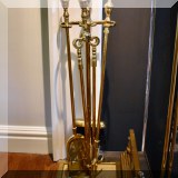 D23. Brass fireplace tools. 